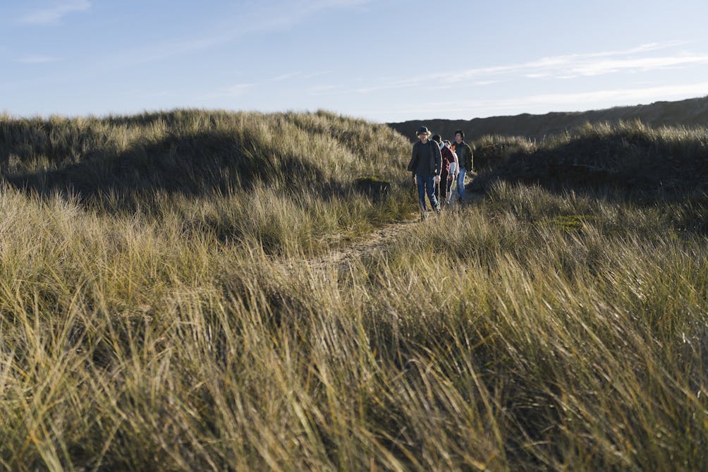 POST 2023 hiking calendar hikers at beach