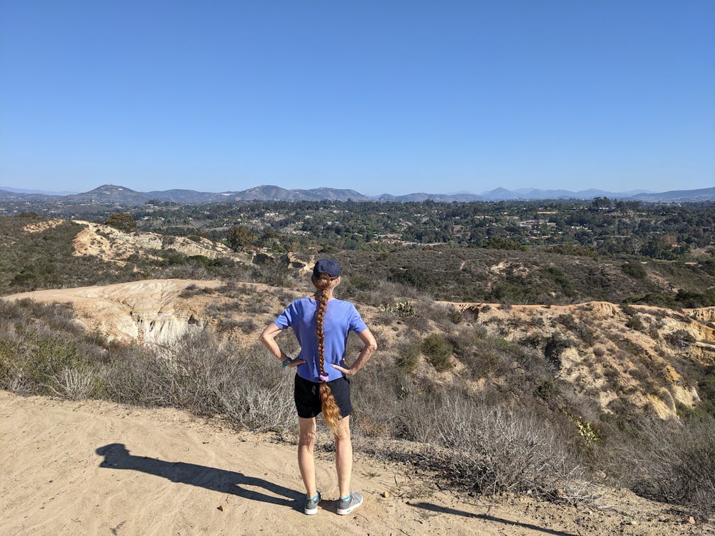 Hiker staring out at mountainous views in Manchester Preserve North San Diego County 