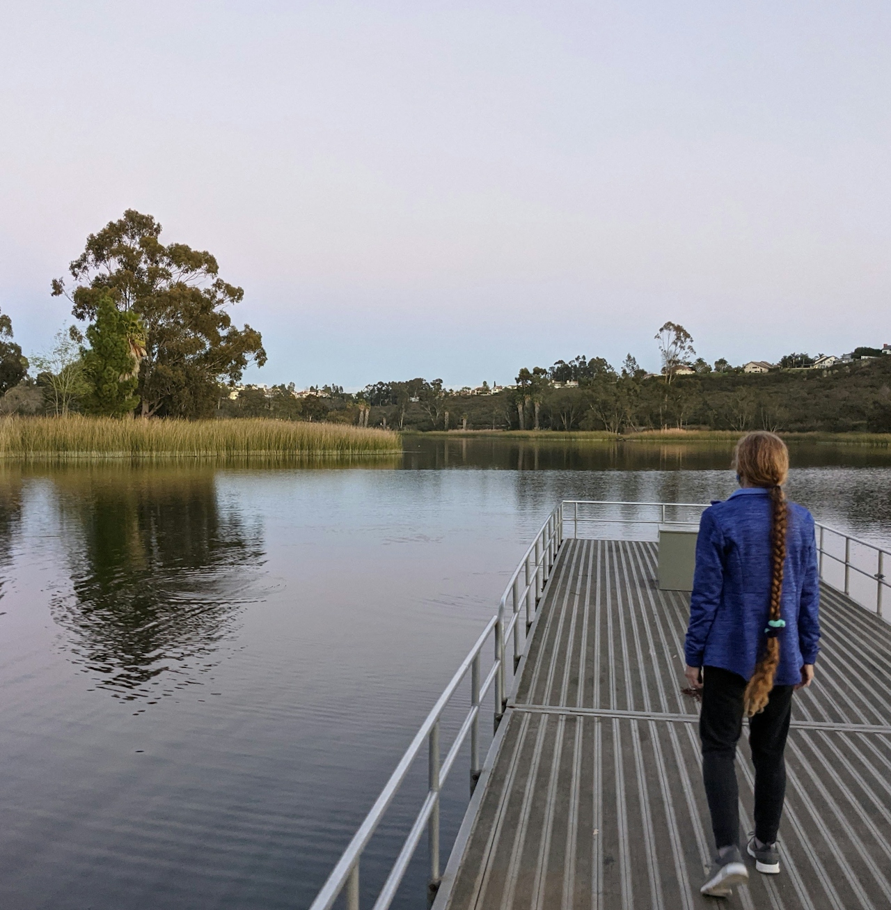 Woman on a dock at Lake Miramar in San Diego 