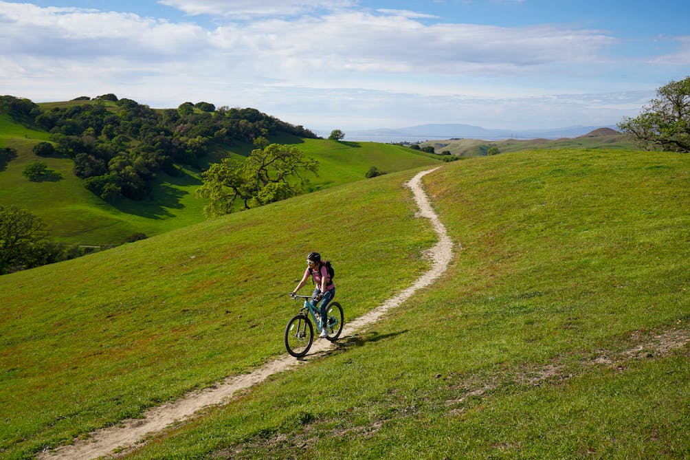 Mountain biker on the trail at Fernandez Ranch in the East Bay John Muir Land Trust