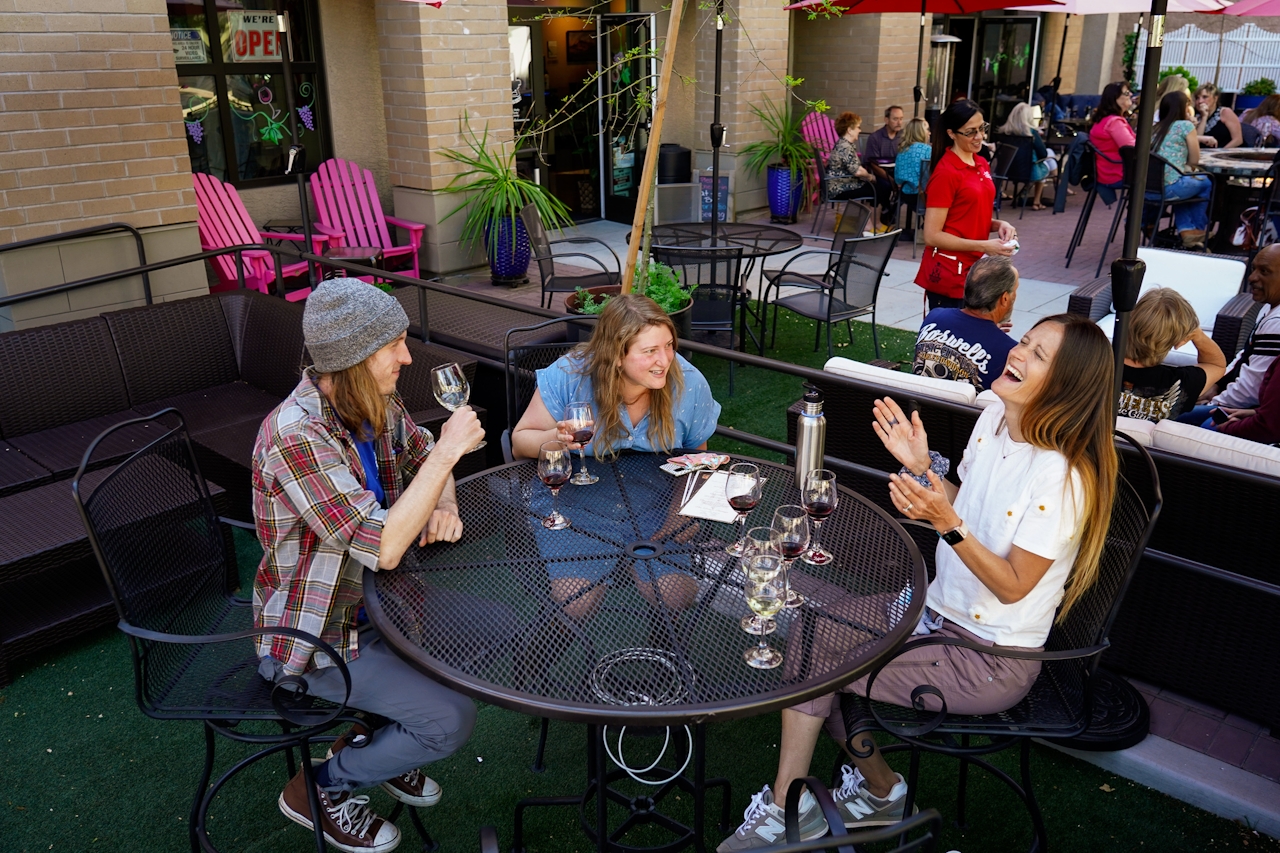 Group hanging out on a patio at Engine 8 Urban Winery 