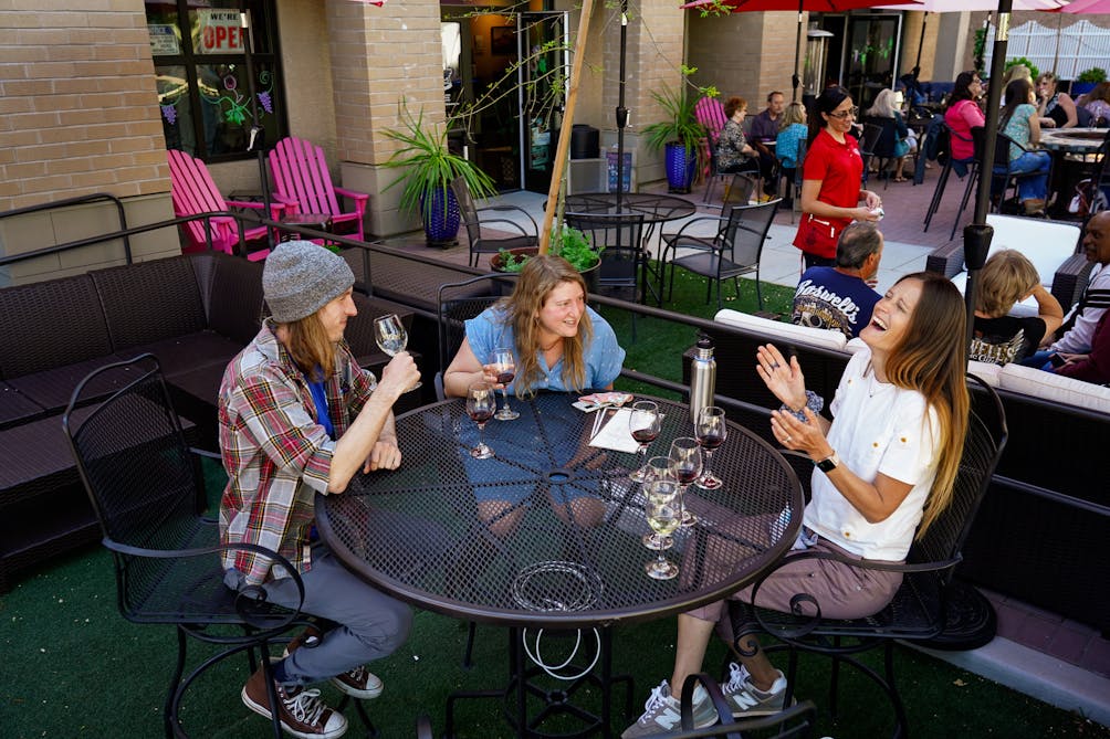 Group hanging out on a patio at Engine 8 Urban Winery 