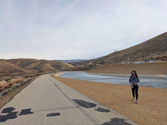 Woman hiking along the Palmdale segment of the California Aqueduct