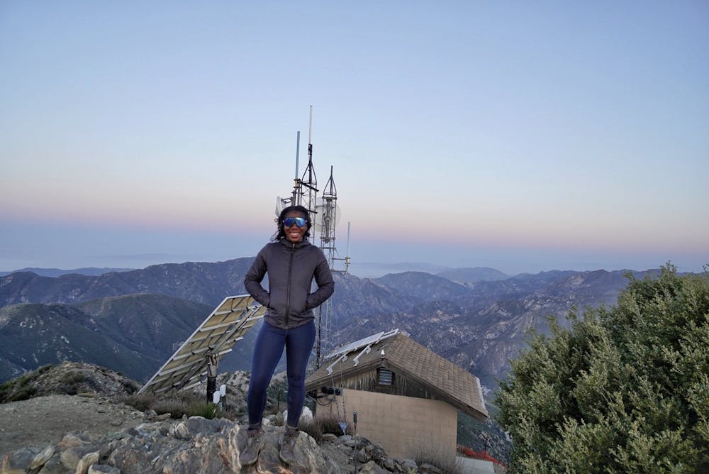 Woman standing at the top of Josephine Peak hike