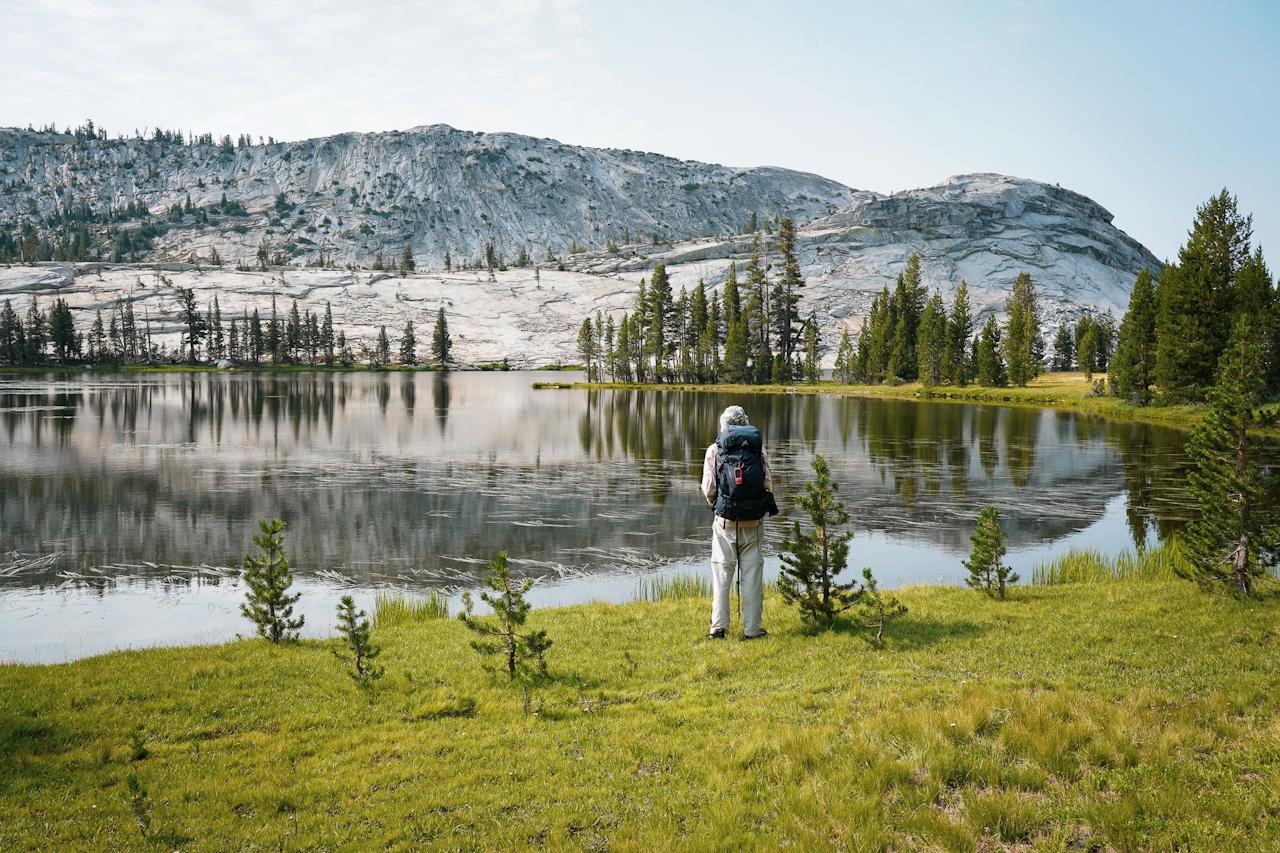 Backpacker at Emeric Lake in Yosemite High Sierra