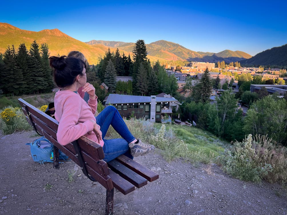 Person watching sunset from bench at Knob Hill Natural Area in Ketchum Idaho 