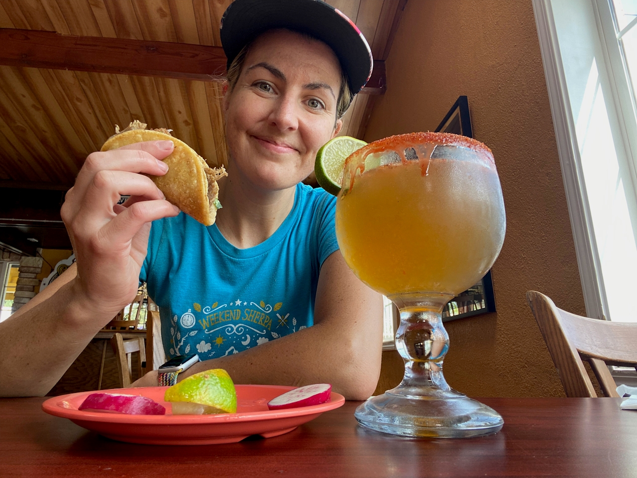 Poe enjoying a taco and a spicey chavela at El Taco De Oro in San Jose 