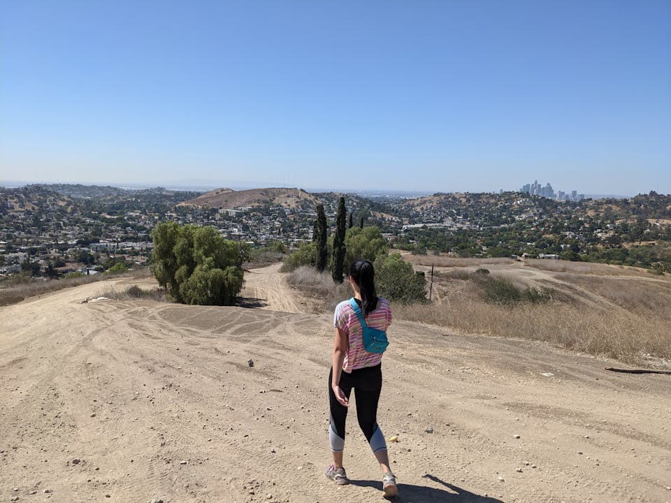 Hiker going down a trail at Elephant Hill Open Space in Los Angeles 