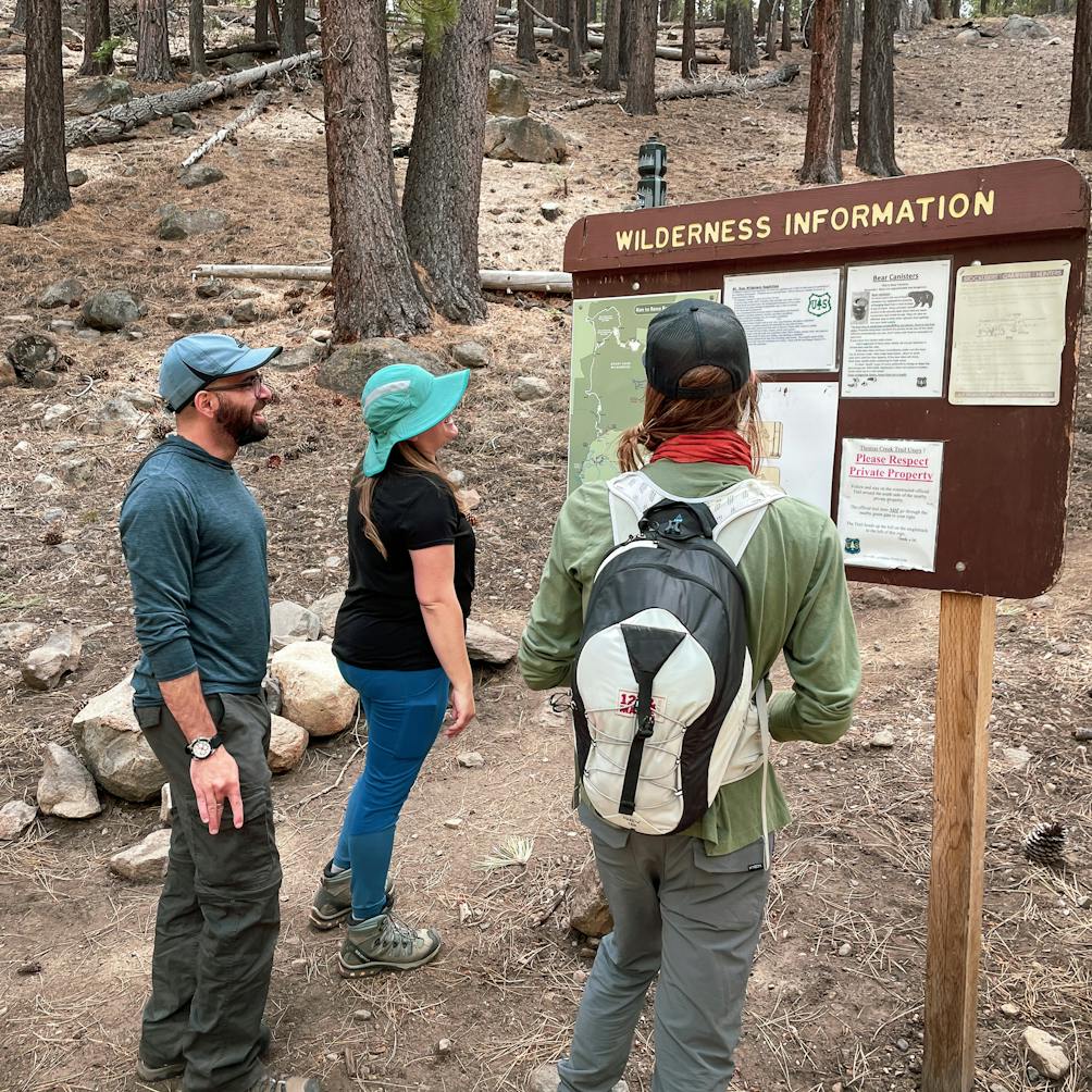 hikers looking at wilderness information sign Mount Rose Wilderness Reno