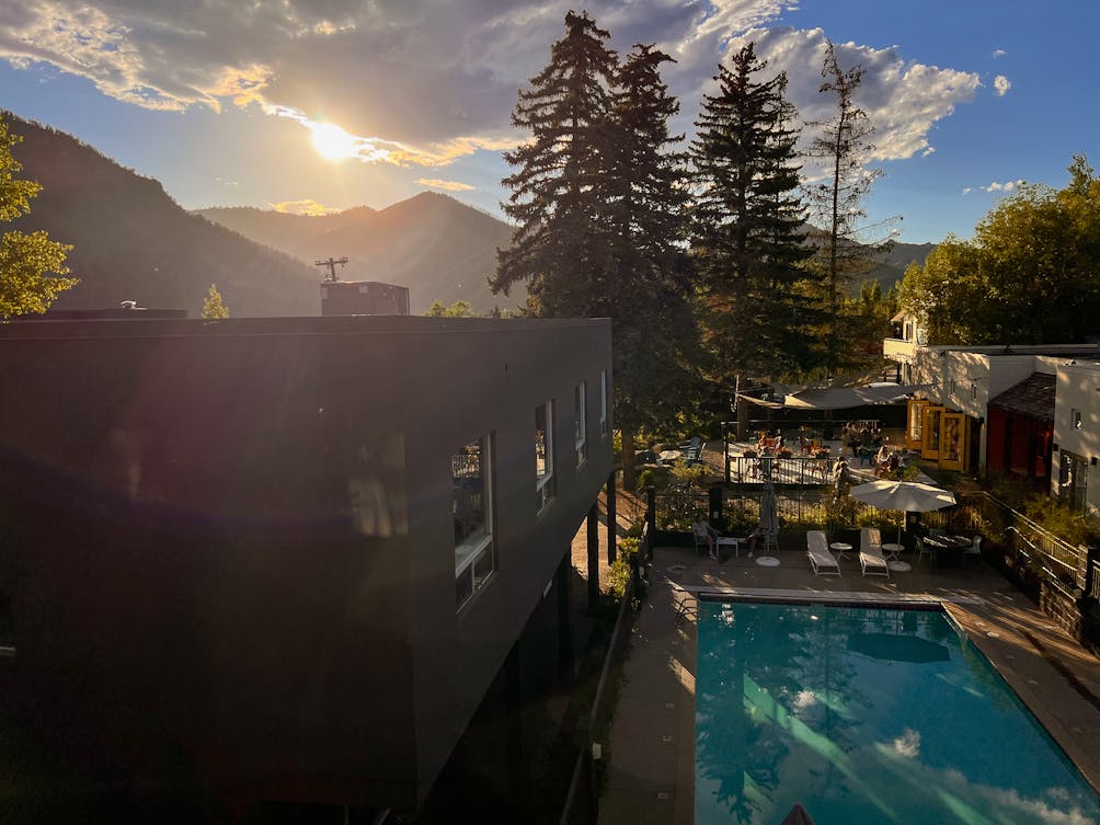 Hotel Ketchum view of pool and mountain scenery 