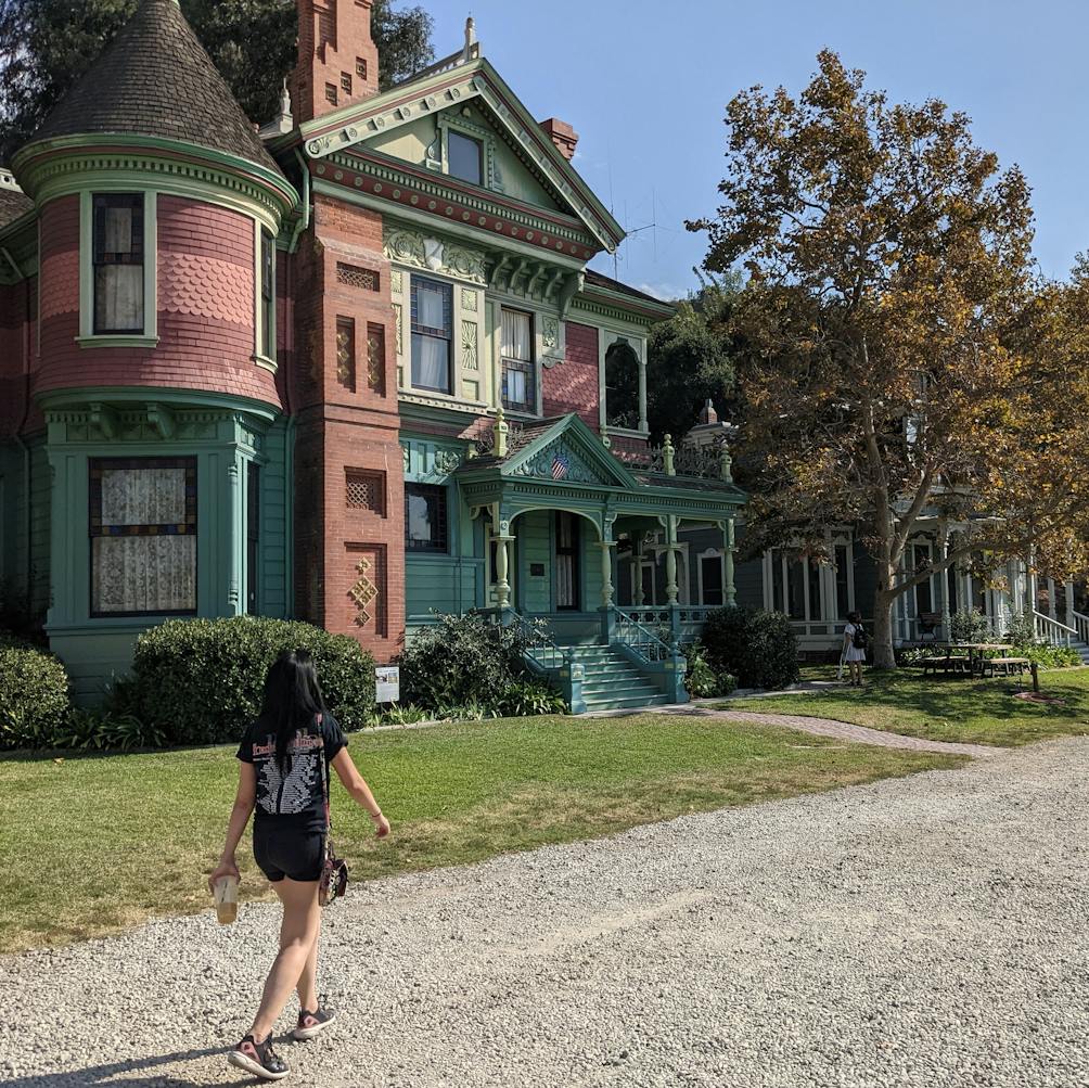 Woman walking up to the Heritage Square Museum in Los Angeles 