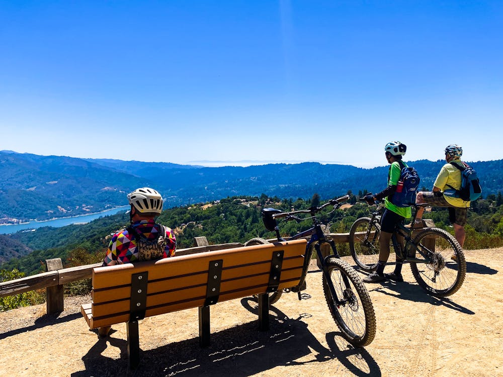 Bikers taking a break to overlook Lexington Reservoir from El Sereno Open Space Preserve Bay Area Ridge Trail South Bay 