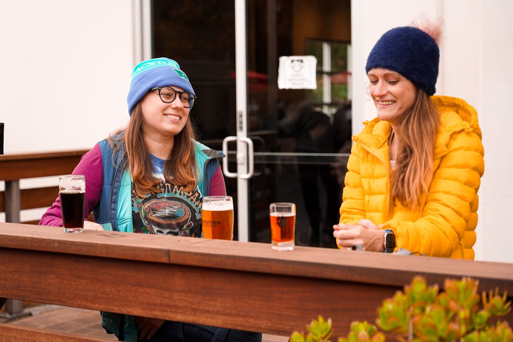 Two women having beers on the outdoor patio at Institution Ale in Camarillo 