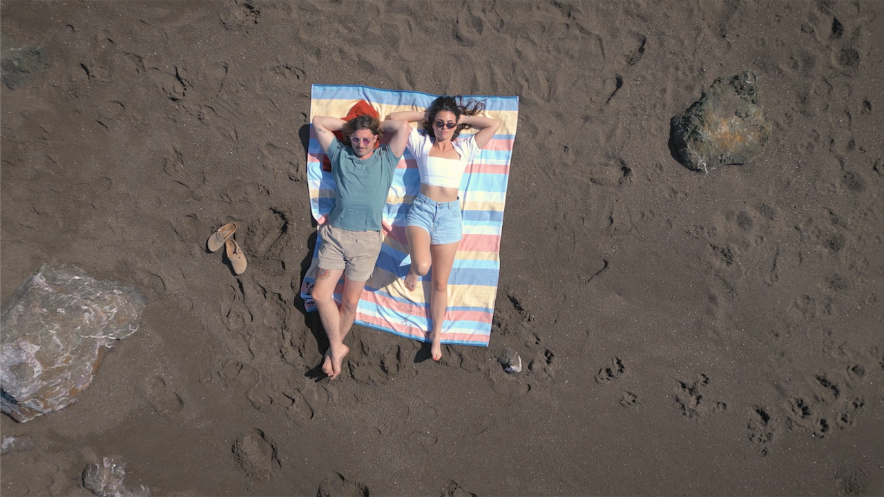 couple relaxing at marin headlands beach
