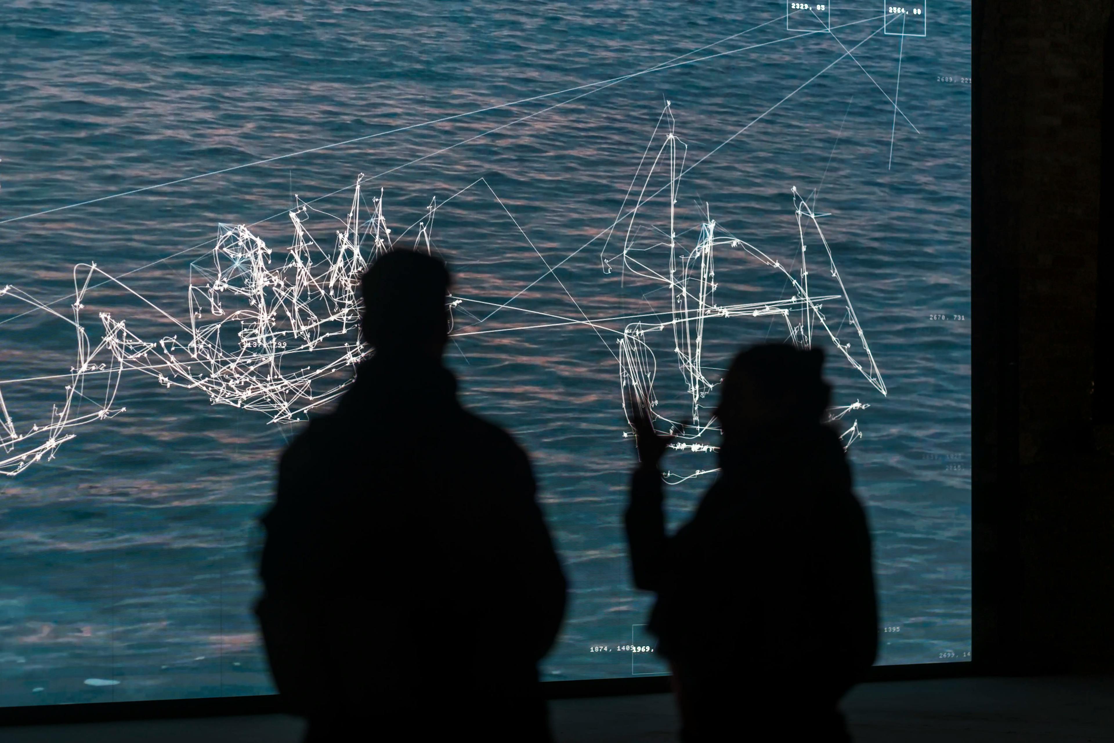 Visitors touring a contemporary art exhibition.