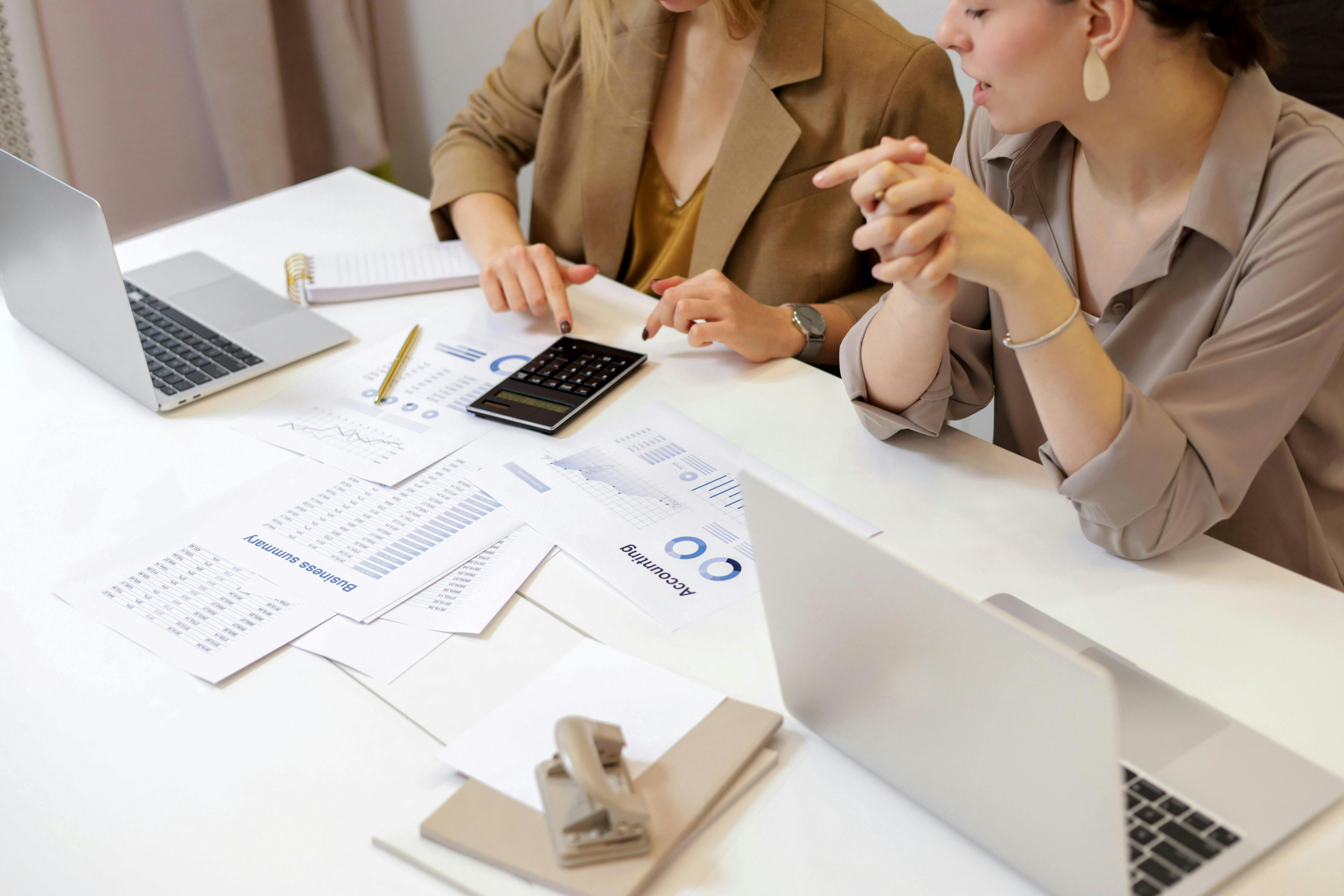 A picture of people having a meeting to manage their finances