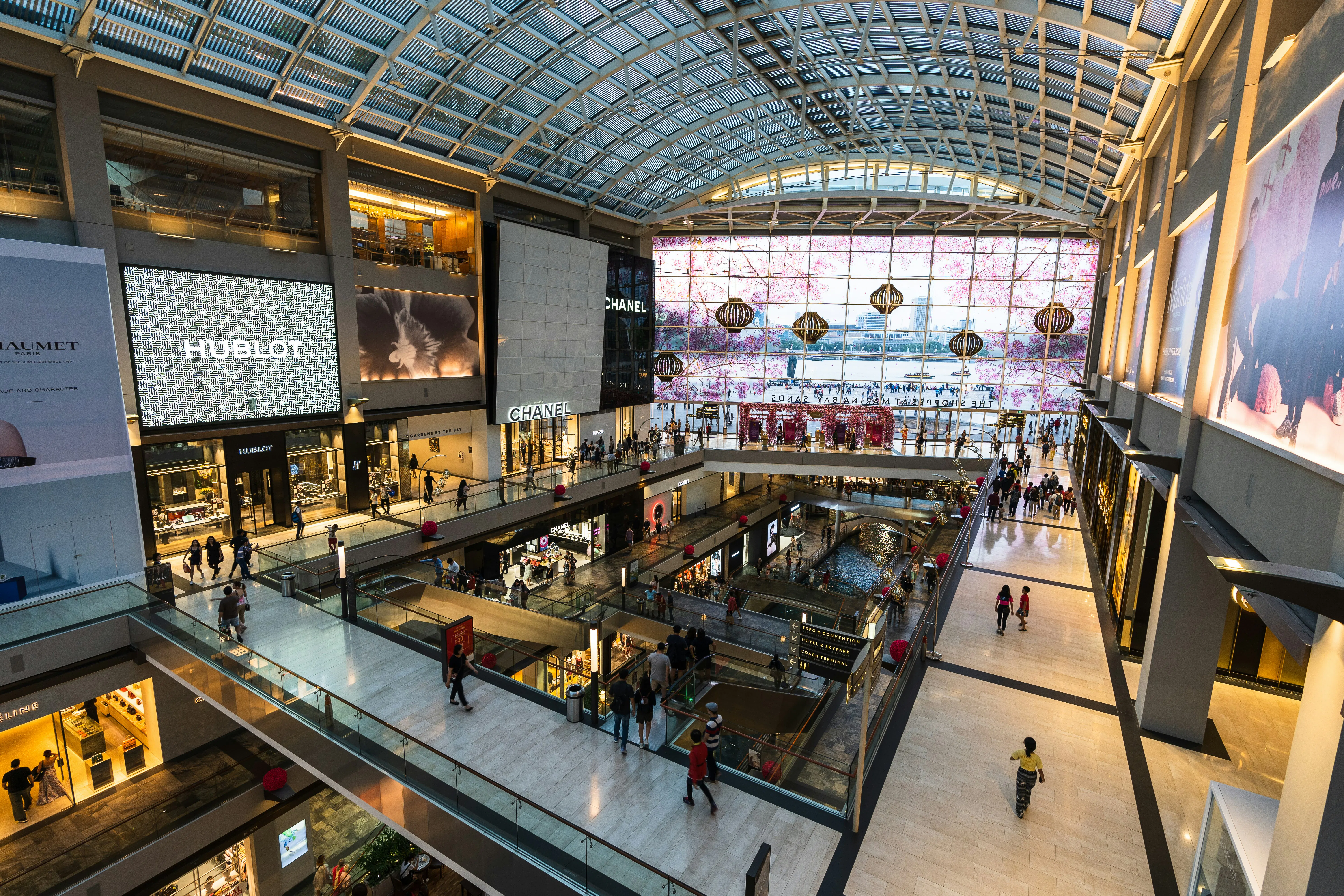 a mall filled with lots of people walking around