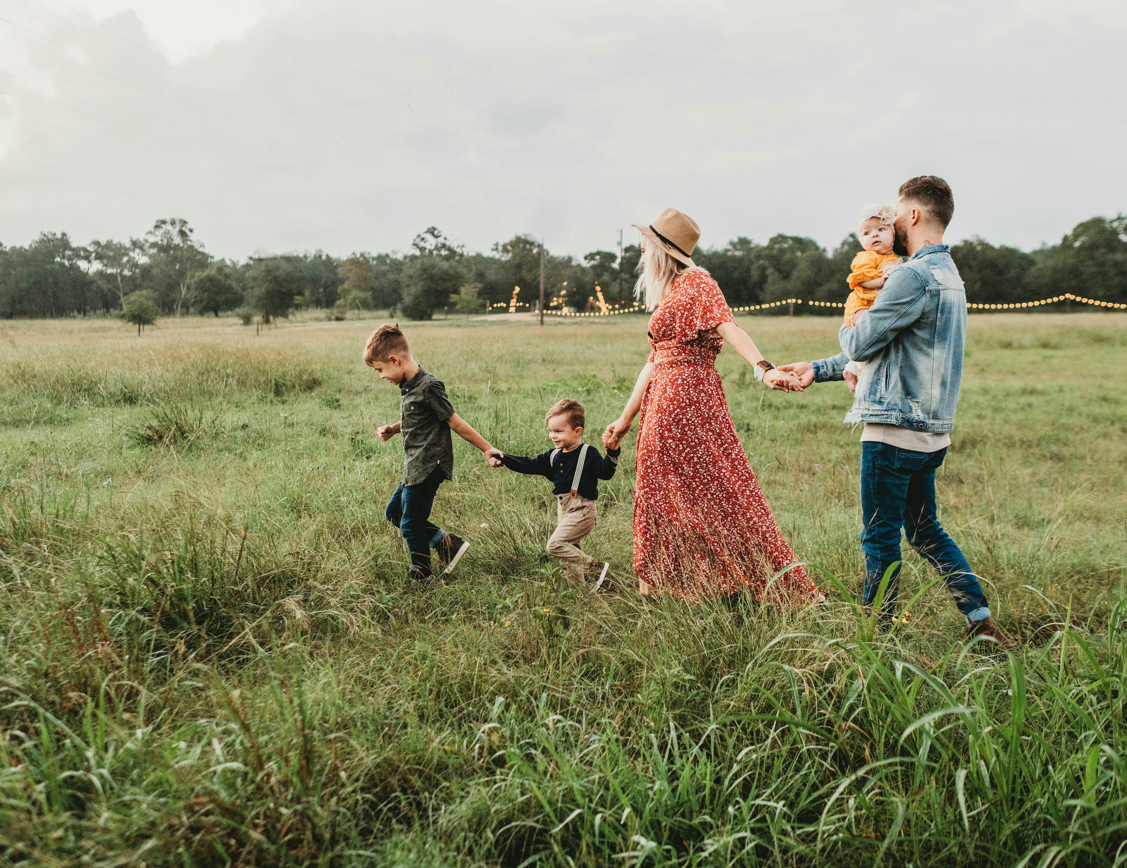 A family walking together in a field