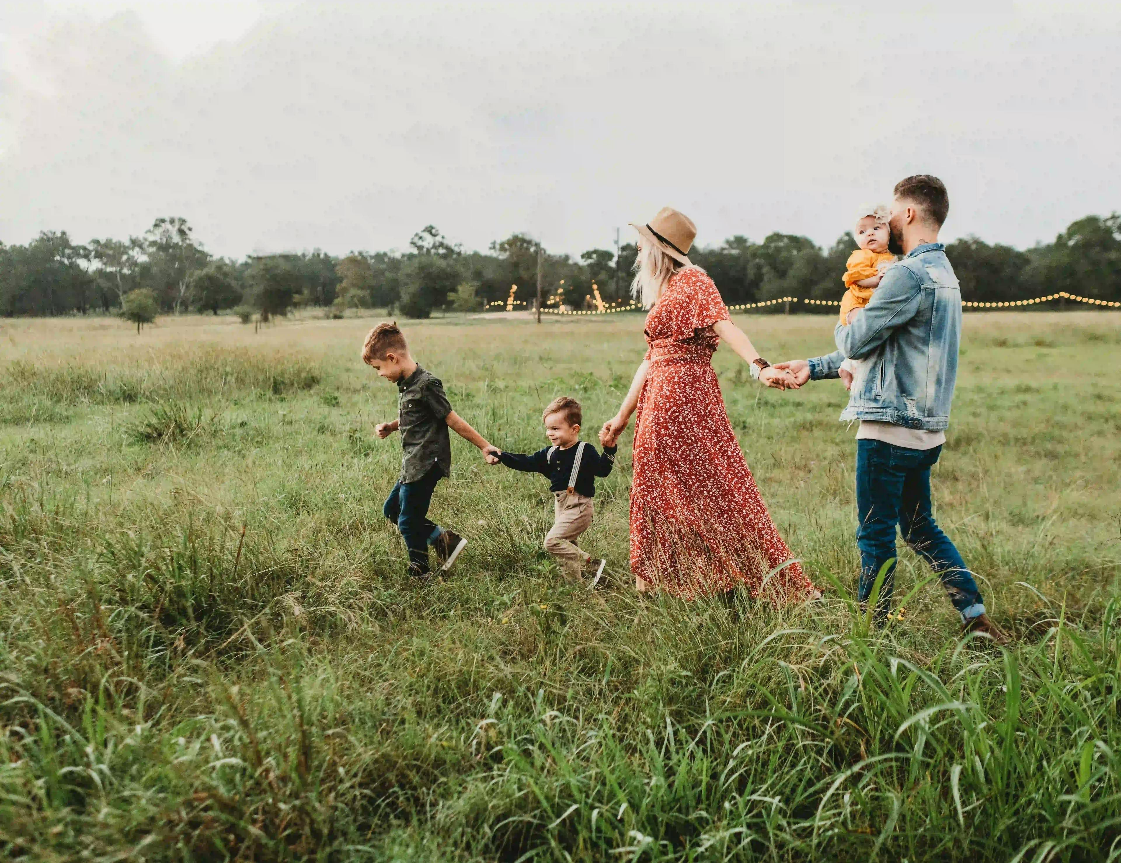 Family walking together in a field