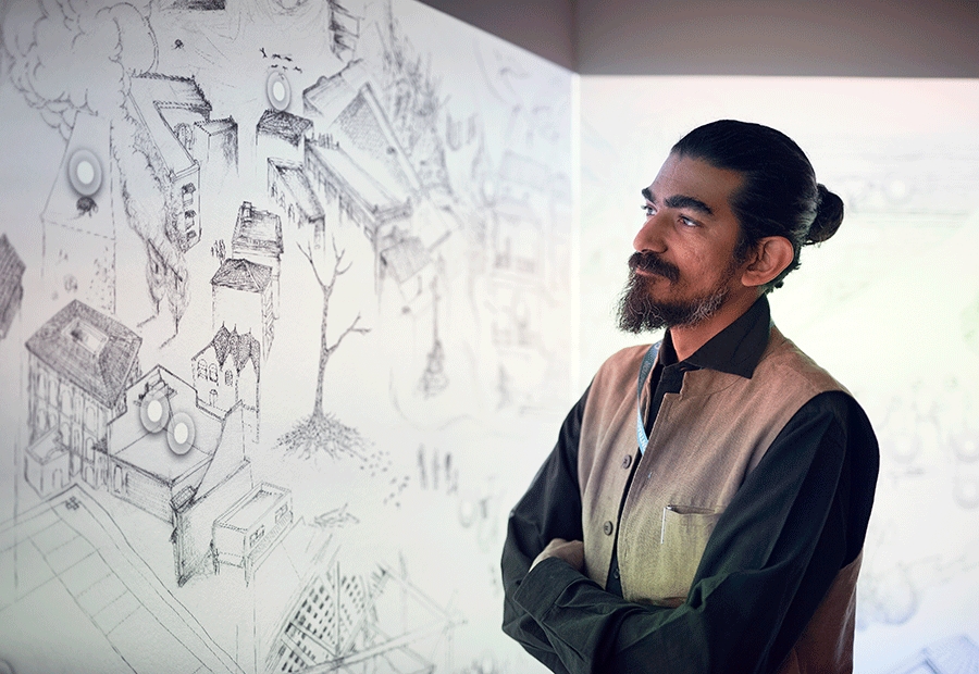 Ranjit Kandalgaonkar views his Drawing the Bombay Plague drawing and digital work