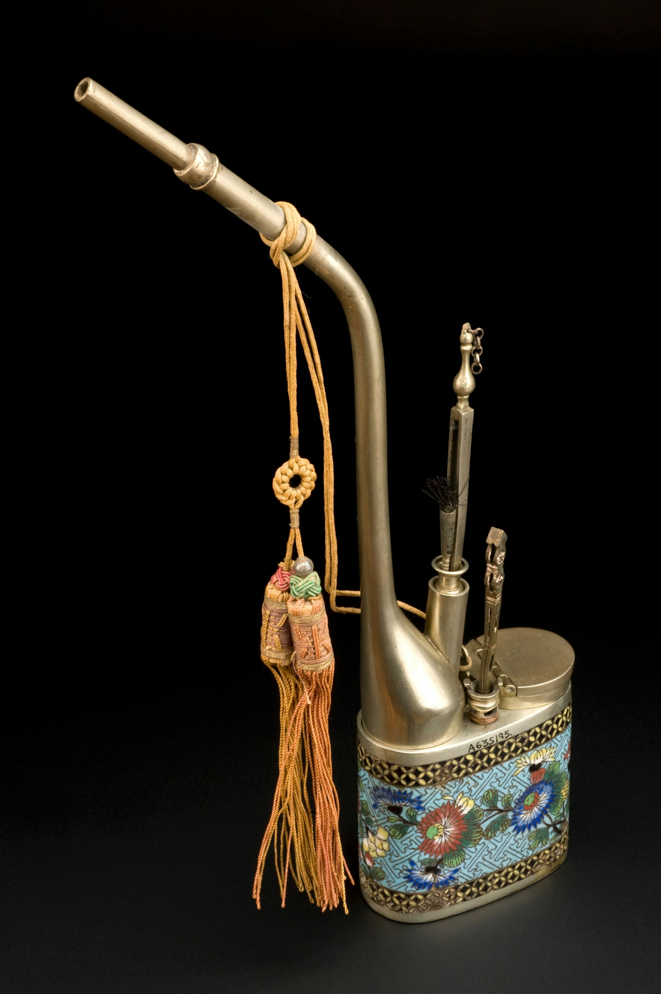 Ornate metal pipe with enamel flower decoration on the main well and a hinged lid.