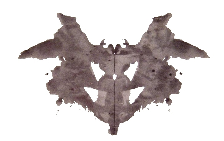 A greyish-black symmetrical inkblot.