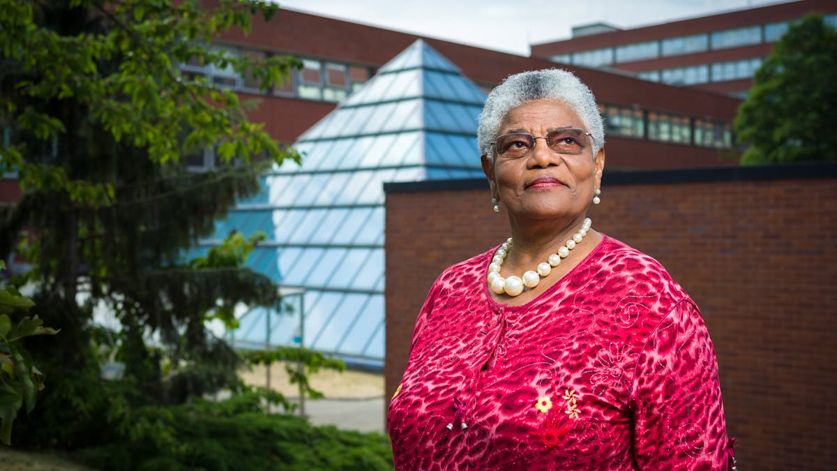 Photographic portrait of Cecilia Brown outside St George's University Hospital, London.