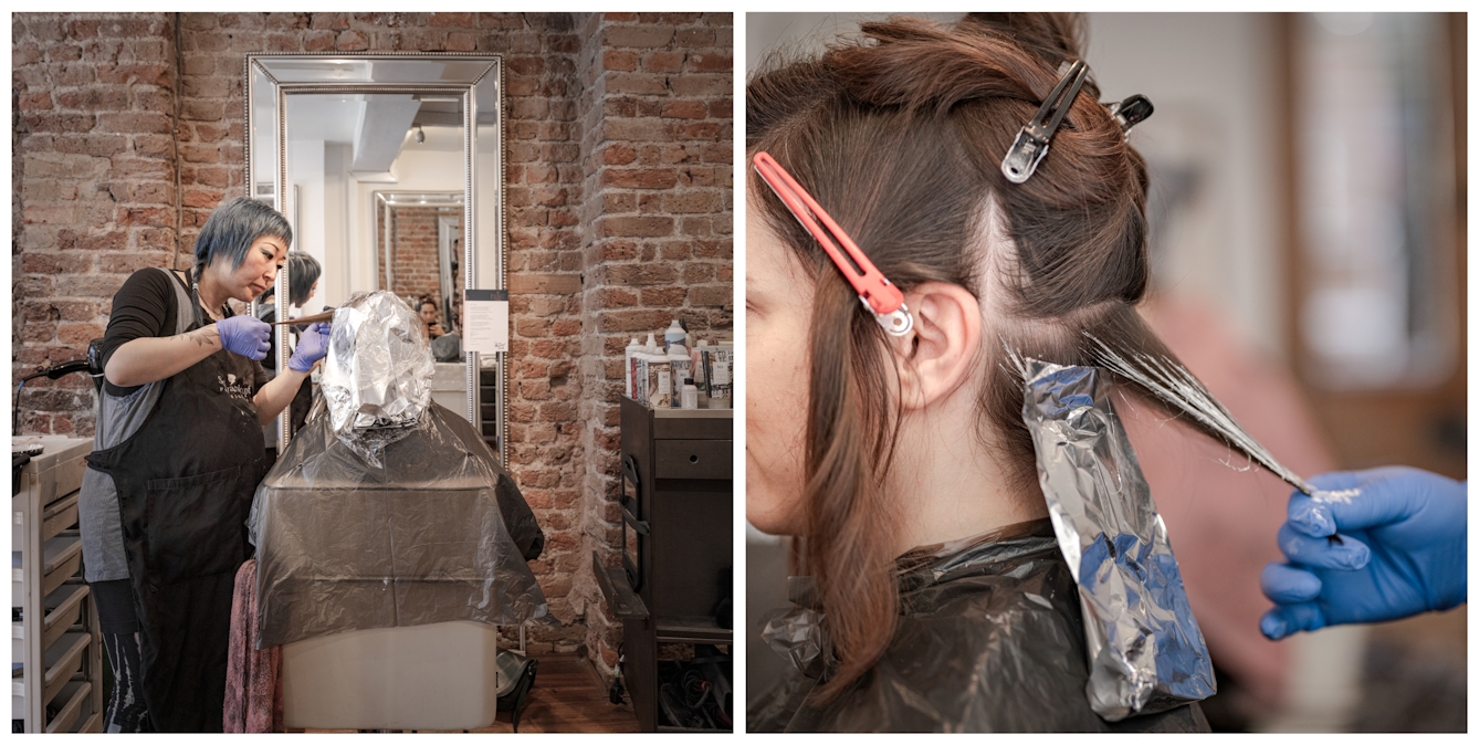 Photographic diptych. The photograph on the left shows a woman from behind sitting in a hairdressing salon chair her hair covered in foil bleaching strips. To her left the hairdresser is treating her hair. The photograph on the right shows a close view of the side of the same woman's head, her hair parted and clipped back to show her scalp. To the right, the blue gloved hand of the hairdresser holds her hair taut whilst applying a bleaching product.  