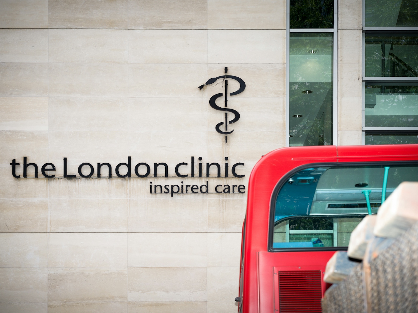 A snake entwined rod on the wall of the London Clinic.