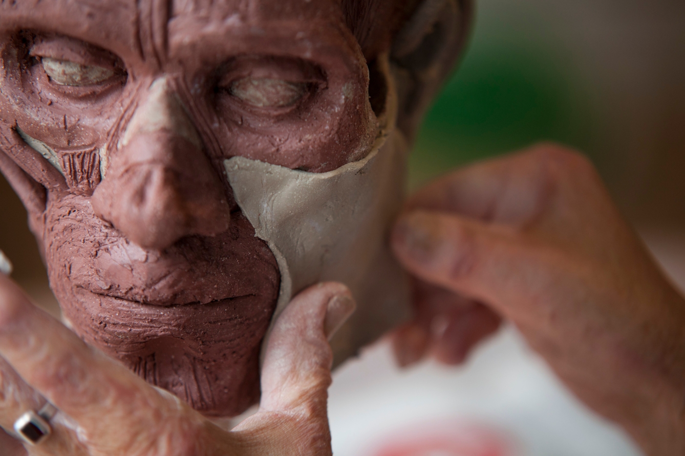 This image forms part of a series of work titled "Stranger than a Wolf" showing the gradual anatomical creation of a human head in clay. 