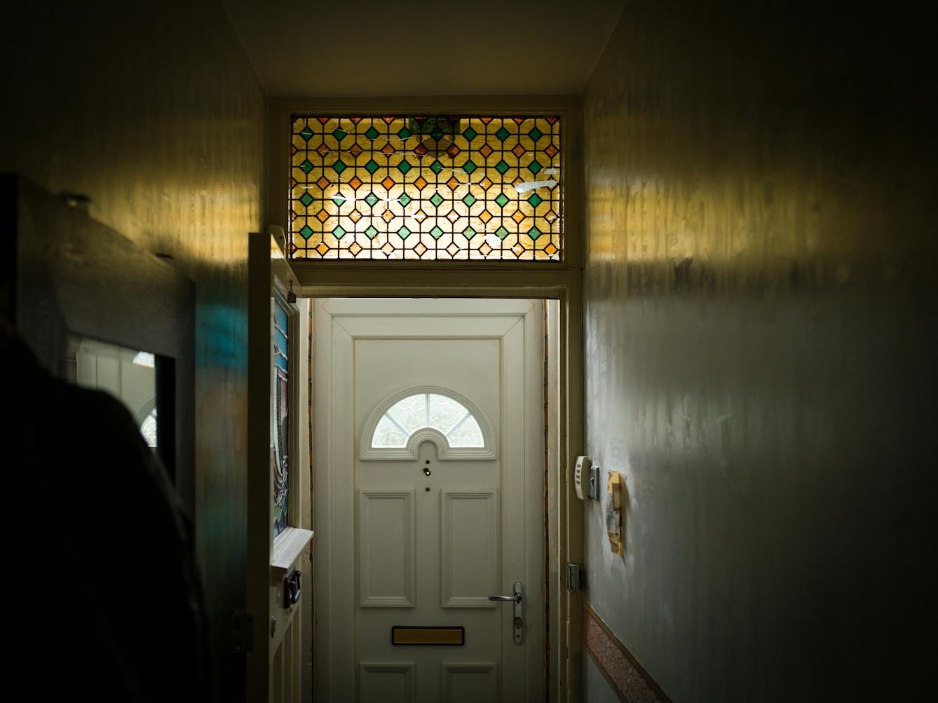 Photograph of Sarifa Patel's front door from inside her house.
