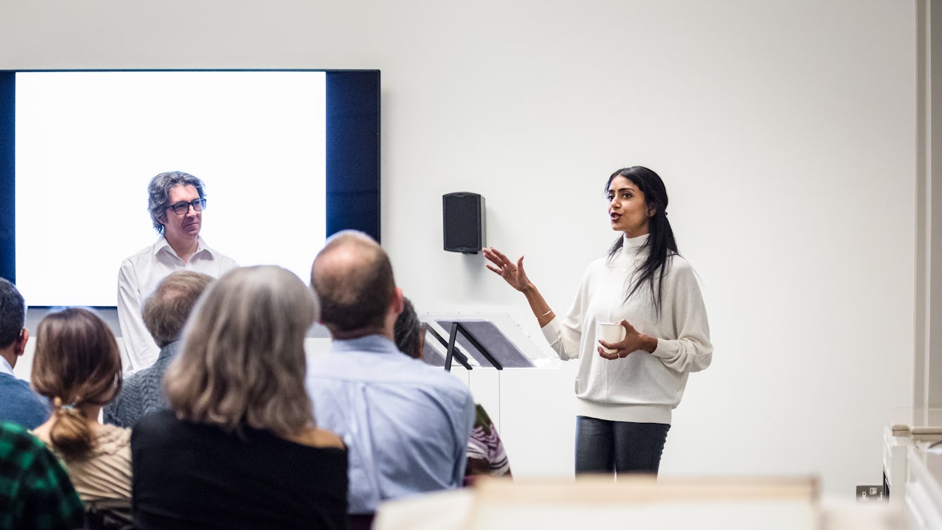 Photograph of Aarathi Prasad talking to an auduience in the Viewing Room at Wellcome Collection during a Library Insights event. The backs of the audience's heads are in the foreground.