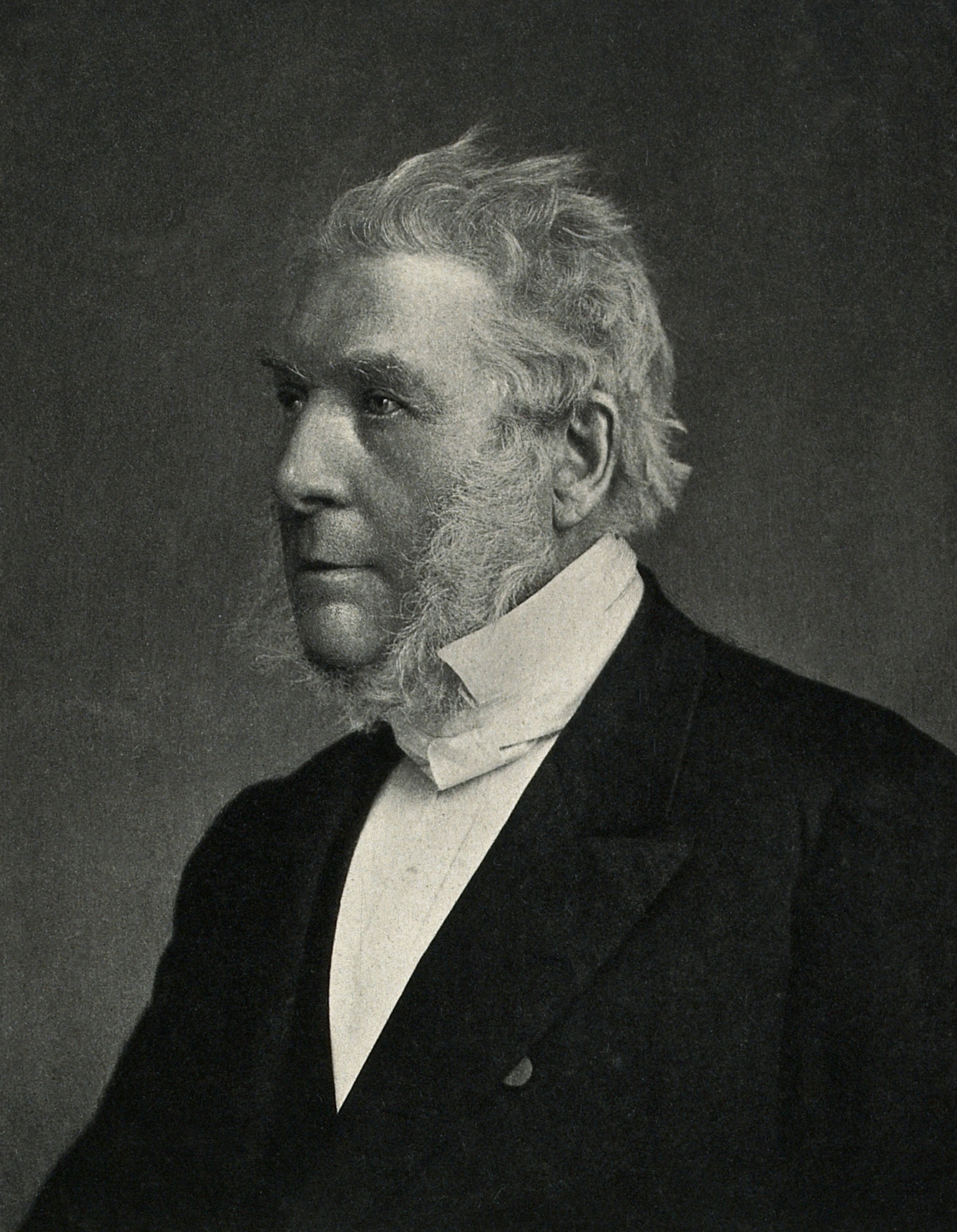 Photogravure of James Glaisher who sits looking into the distance. 