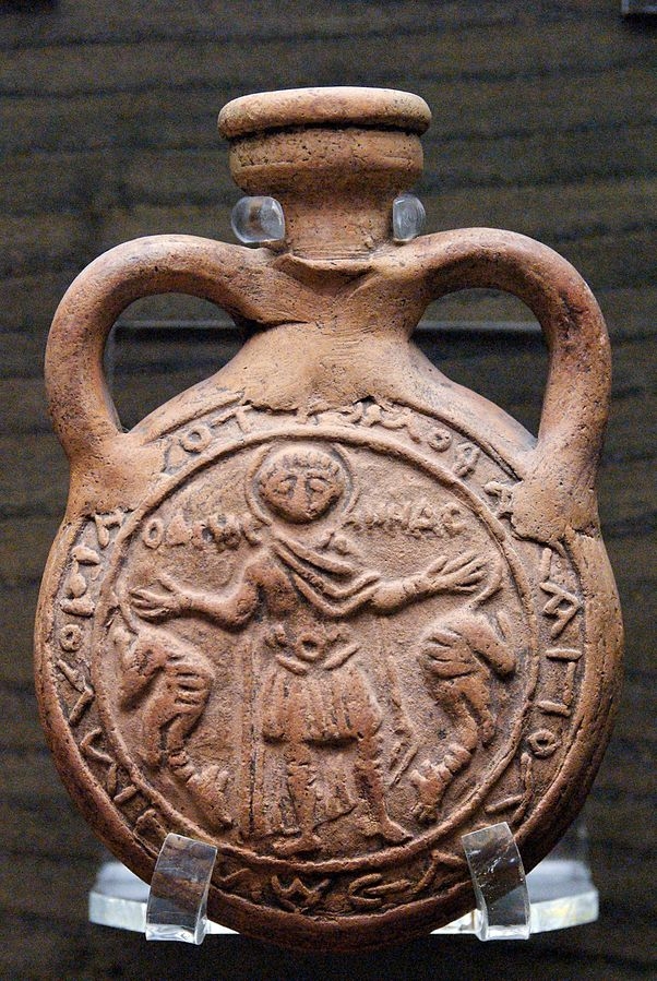Photograph of a pilgrim flask, which depicts St Menas with two camels.