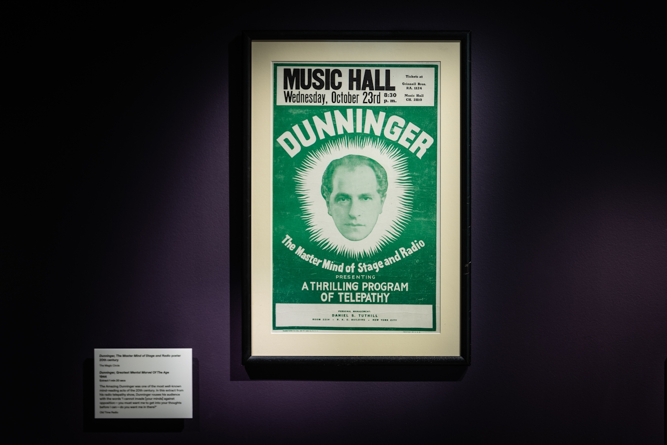 Photograph of a framed poster for the performance titled 'Dunninger', as part of the Smoke and Mirrors exhibition at Wellcome Collection.