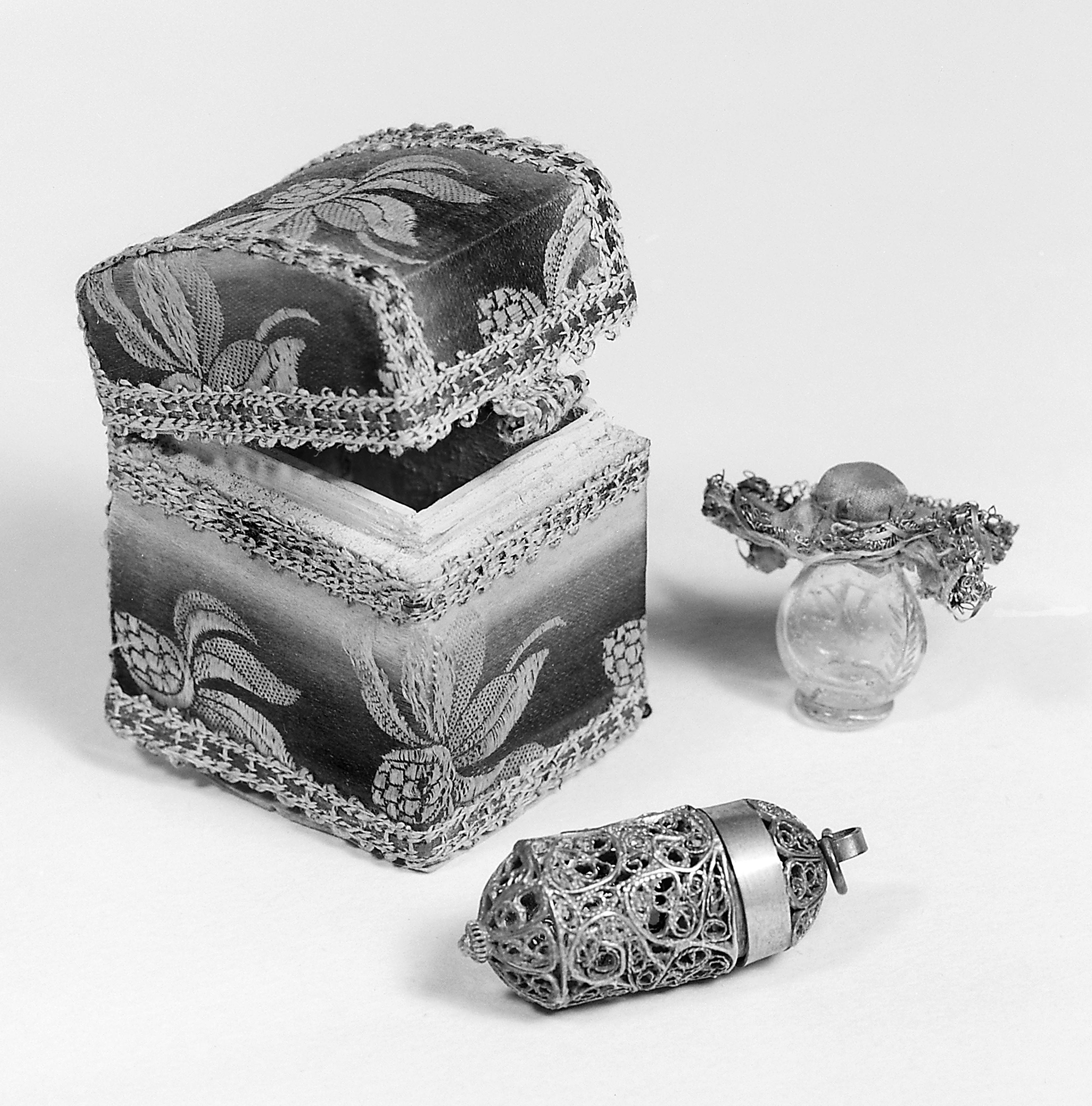 Walpurgis oil with a small damask box with filigree casket and small glass flask for oil.