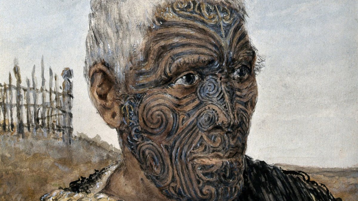 Image of man with white hair and facial tattoos