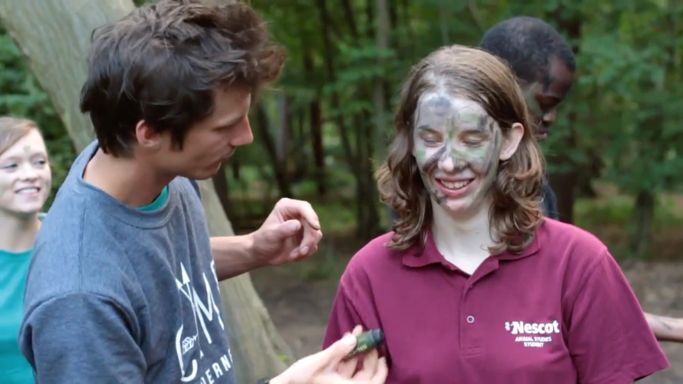 Film still from 'Disconnected' a RawMinds film project showing a young woman having face paints applied.