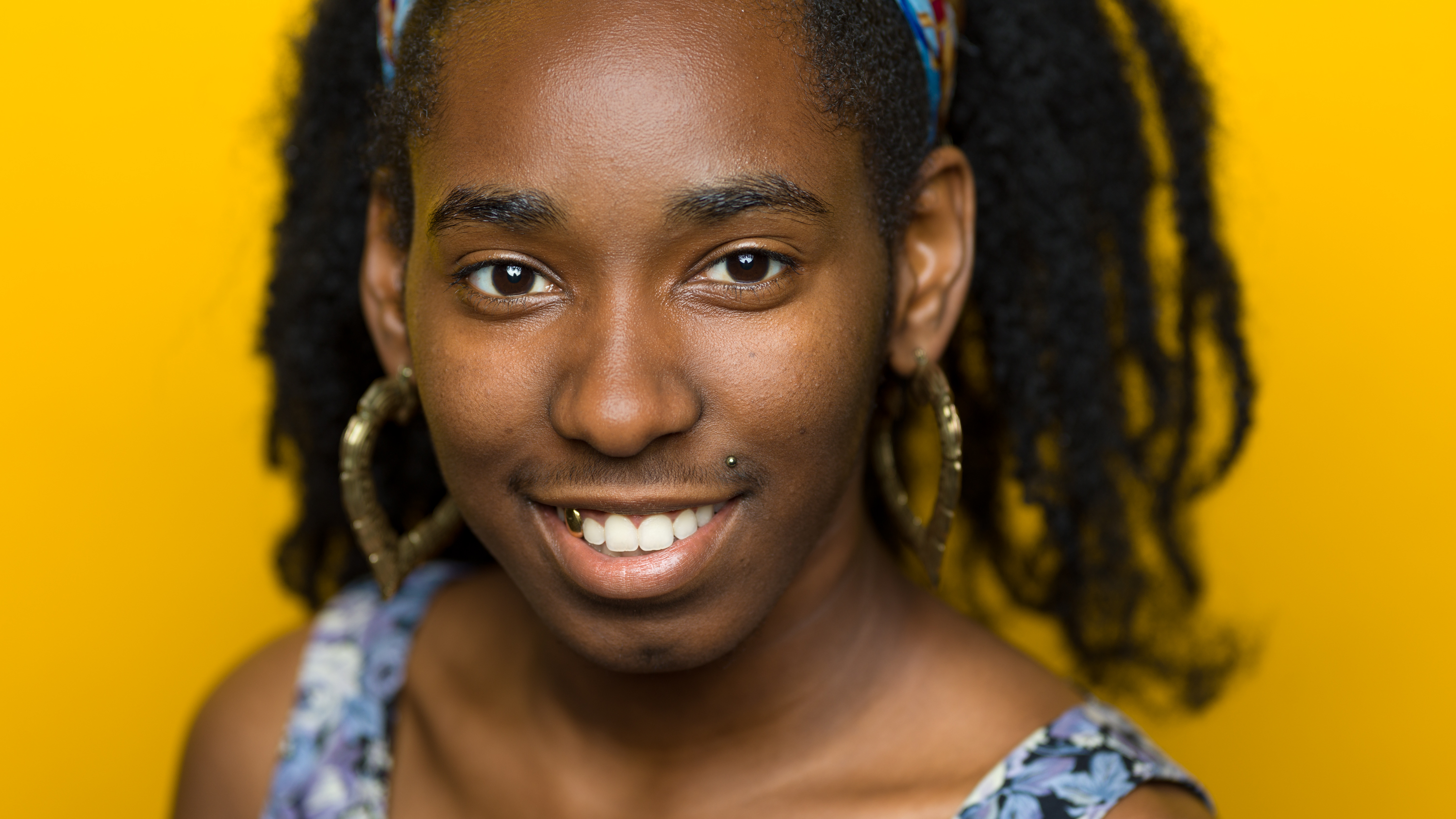 Photographic portrait of Abondance set against a yellow background
