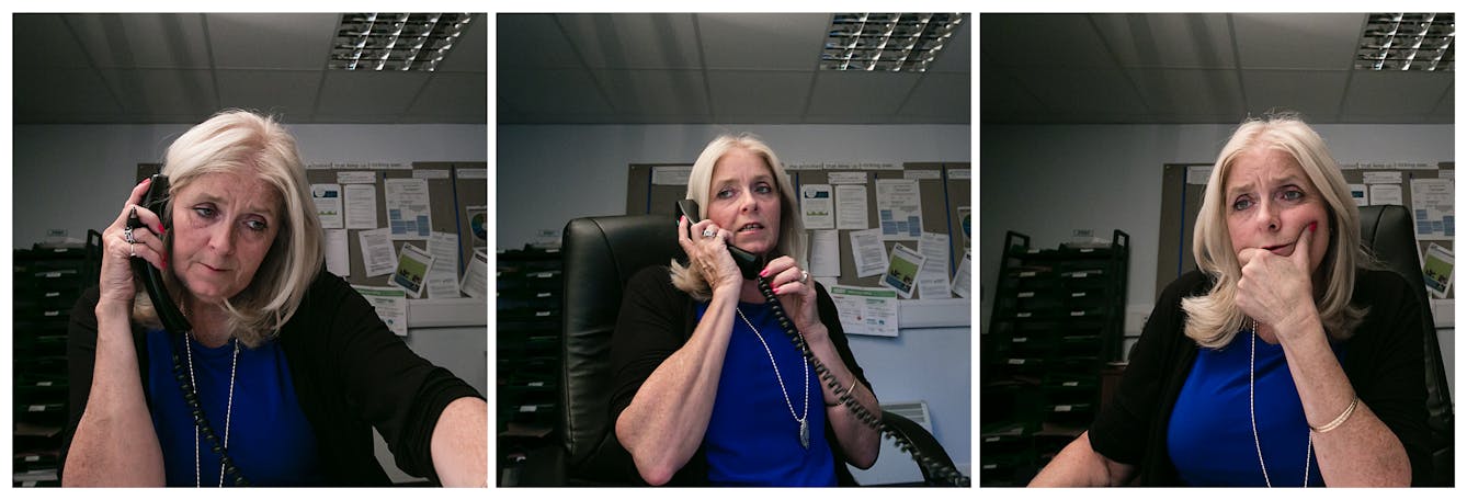 Photographic triptych showing the same woman in each image, sat in an office environment. In the left hand image the woman holds a landline telephone receiver to her right ear. She is looking down off to camera right. In the middle image she holds the receiver to her right ear and she is looking away to camera left, mid sentence. Both hands hold the receiver. In the right hand image she is not holding the receiver but has her left hand supporting her chin and appears to be looking into a screen off to camera right.