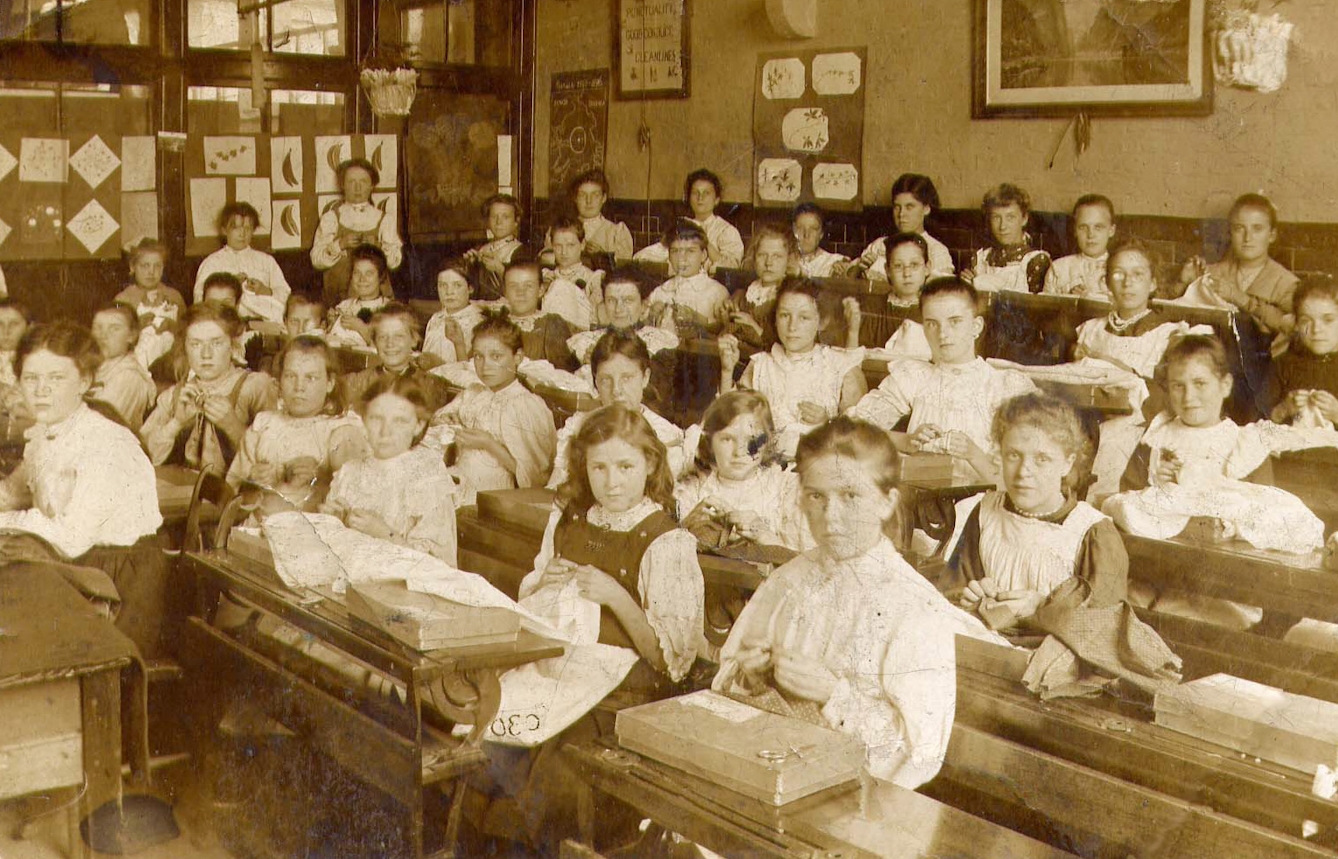 Victorian schoolgirls in a needlework class