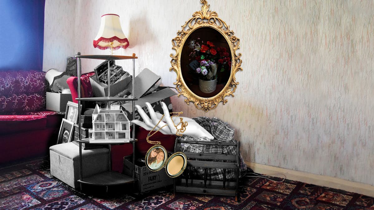 Colourful photograph with some coloured and black and white collage elements. The photo is of an empty living room with patterned off-white wallpaper, a red floral patterned sofa and a patterned carpet. There are pieces of black and white furniture in a pile next to and on top of the red sofa, including lamps, picture frames, storage bags, jewellery boxes and a shelving unit. On the shelving unit is a three story dollhouse which is empty. A black and white mannequin hand is shown coming out of a storage bag, and laced between its fingers is a golden pendant which is open and contains a photo of a girl and her grandma. On the wall is a ornate golden photo frame that contains a photo of a vase of different coloured flowers and a hairbrush. 