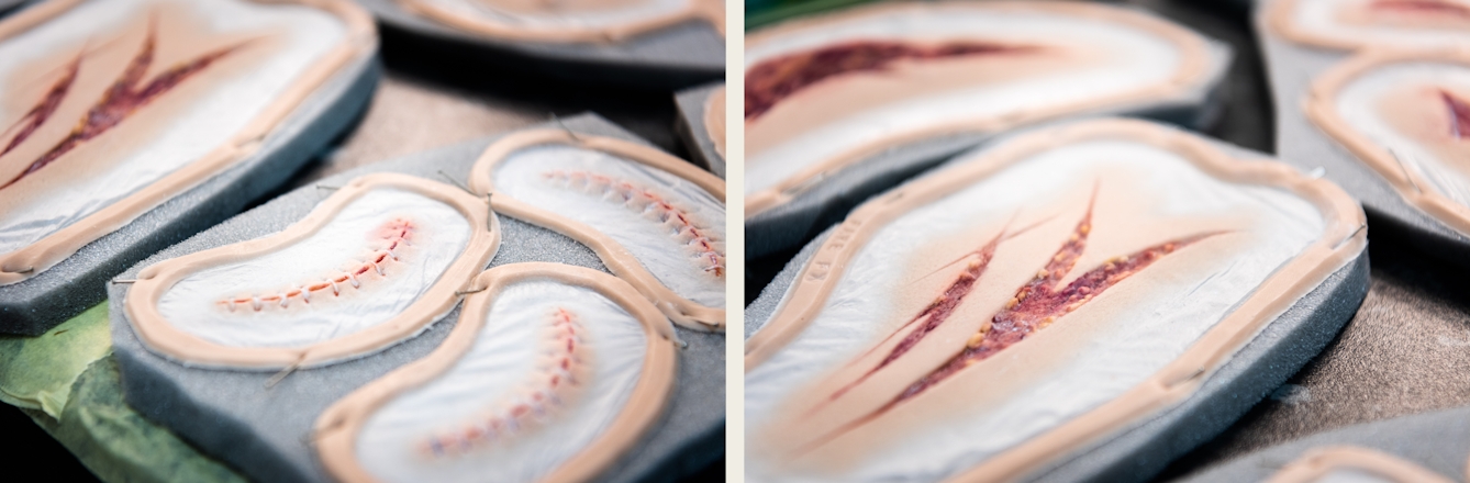 Photographic diptych. Both images show prosthetic makeup pieces resting on sections of foam. The prosthetics represent wounds that have been stitched up and wounds that are gaping.