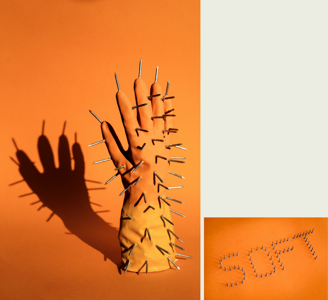 Photographic diptych, one large vertical image on the left and one smaller horizontal image on the right. The one on the left shows the right hand of a pair of rubber gloves. The orange and yellow glove is standing upright, fingers into the air, on an orange background. The glove is padded so it looks as if there is a hand inside it. Sticking out of the glove all over the surface are metal carpentry nails, points outwards. The scene is lit by a hard contrasty light which is casting a long dark shadow of the glove and nails onto the background. The image on the right shows the word 'SOFT' spelt out with metal carpentry nails balancing vertically on their heads, on an orange  background.