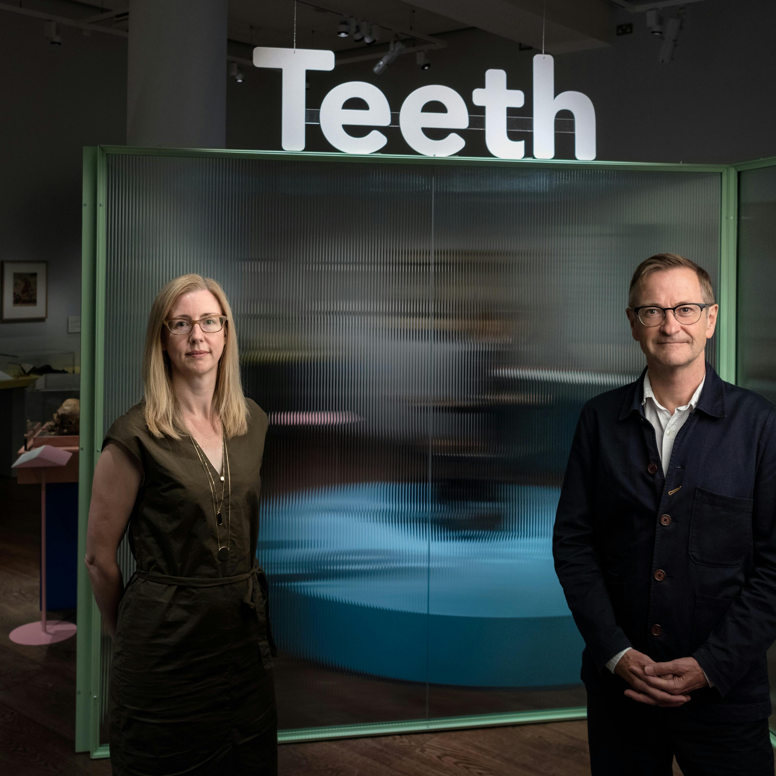 Emily Scott-Dearing and James Peto stand at the entrance to the Teeth exhibition