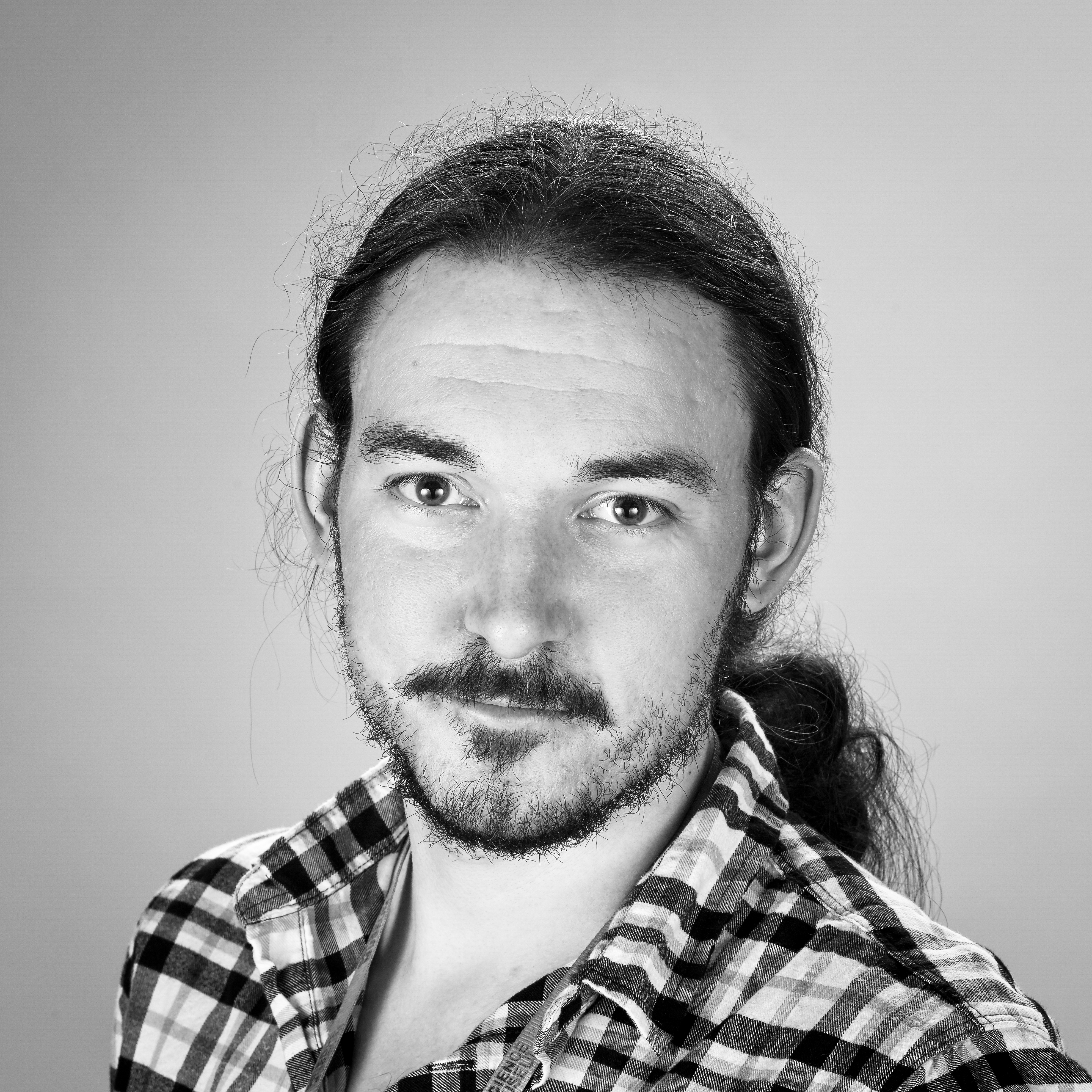 Head and shoulders, black and white portrait of Kevin Percival.