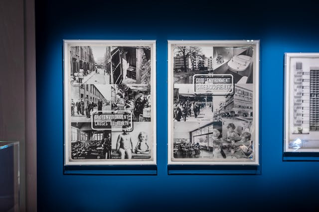Photograph of framed works on hanging on the wall of the exhibition, Living with Buildings at Wellcome Collection.