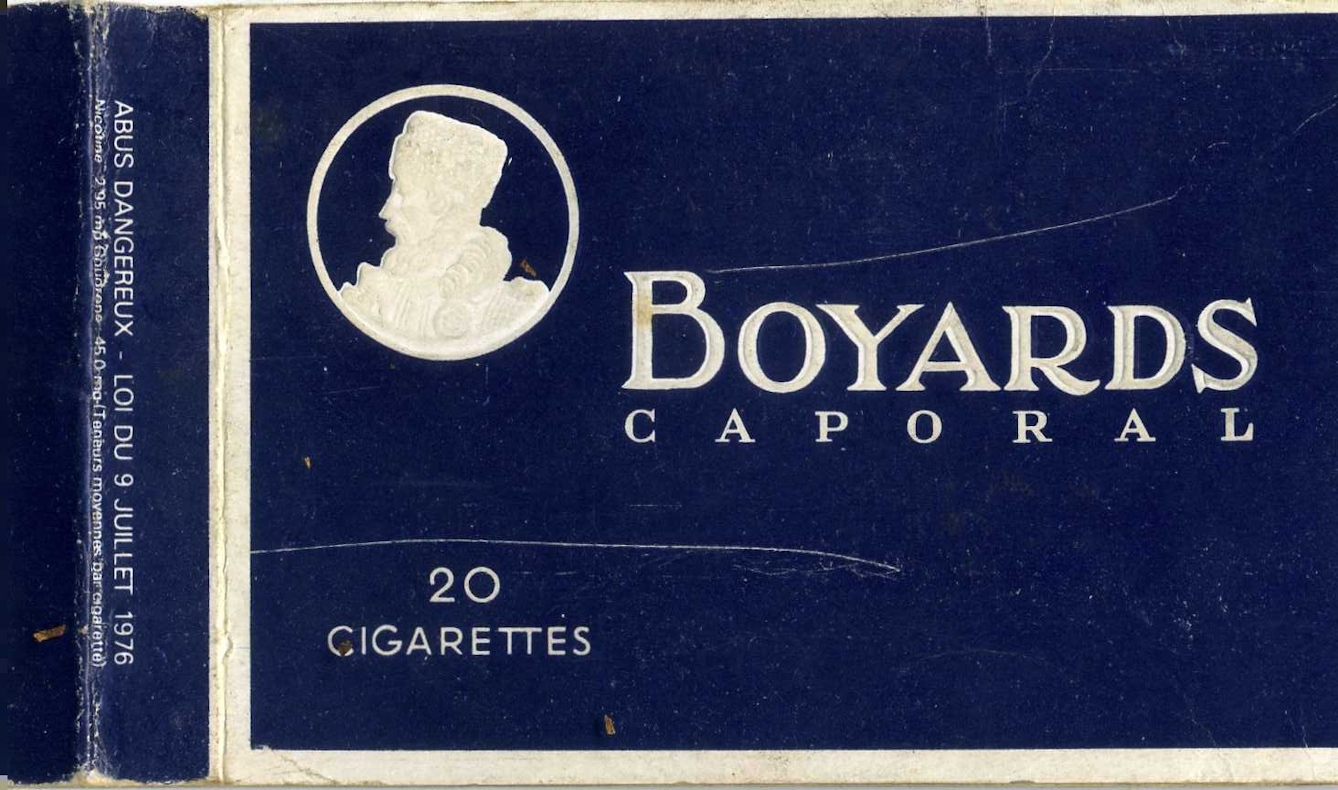 Colour photograph of a part of 20-pack of 'Boyards Caporal' cigarettes. The packaging is dark blue with white text.