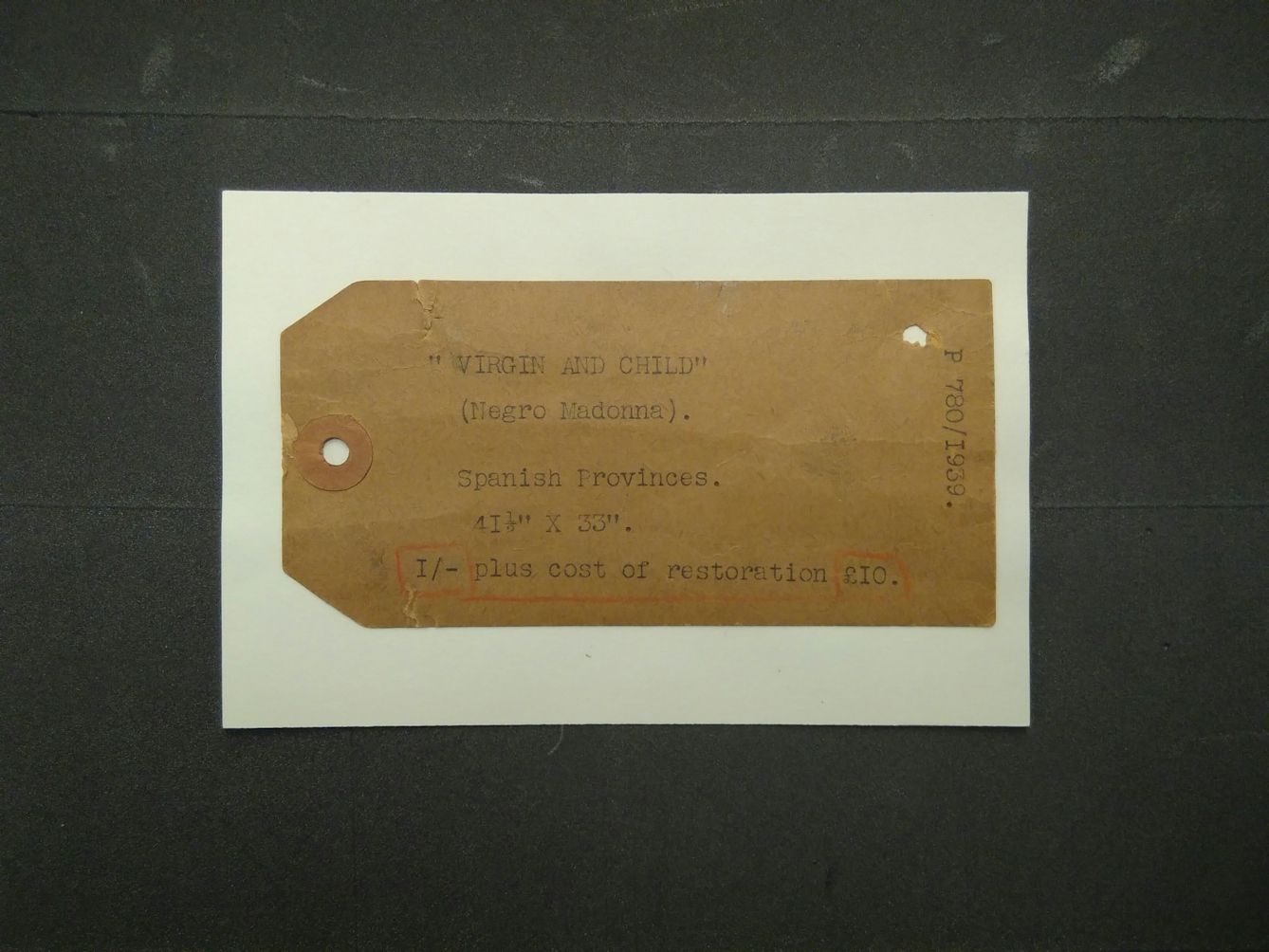 Old cataloguing label for our painting – probably written in 1939 when the painting was entered in our registers
The concept base of most museum collections from the 18th to the early 20th century was the evolutionary philosophy, which assumed the superiority of western cultures. This way of thinking informed the language used to describe and catalogue museum objects, the use of the term ‘Negro Madonna’ here is a good example of this bias.