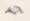 Pencil drawing of a woman’s head, reclining on a pillow.